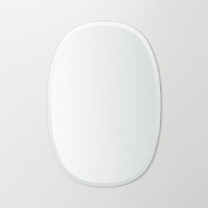 Frameless beveled oblong oval mirror hanging on beige wall