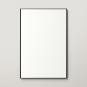 Black metal framed rectangle mirror hanging on beige wall