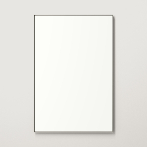 Nickel metal framed rectangle mirror hanging on beige wall