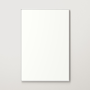 White metal framed rectangle mirror hanging on beige wall