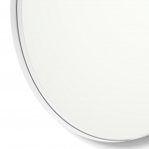 Close-up angle shot of white framed round mirror
