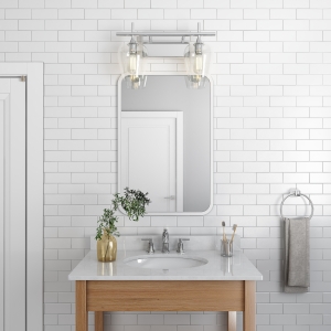 White rubber framed rectangle mirror hanging on bathroom tiled wall above wood single sink vanity